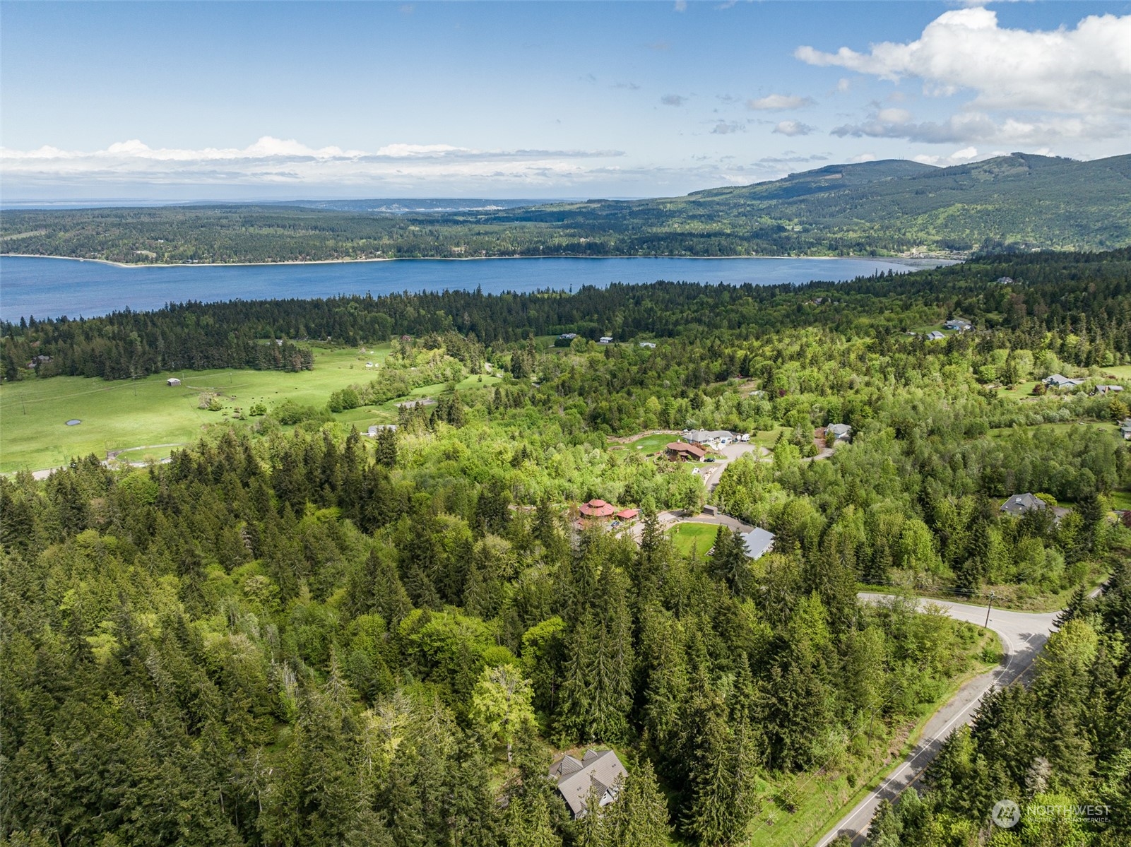 999 Louella Road Sequim, WA 98382 - Photo 14 of 38 a view of a lake with a mountain in the background