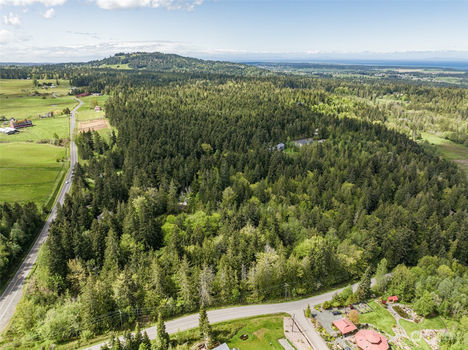 999 Louella Road Sequim, WA 98382 - Photo 9 of 38 an aerial view of residential houses with outdoor space