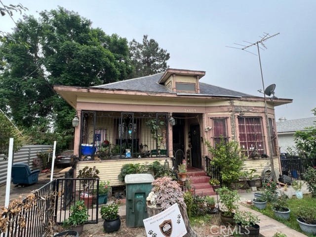 a view of a house with sitting area and garden