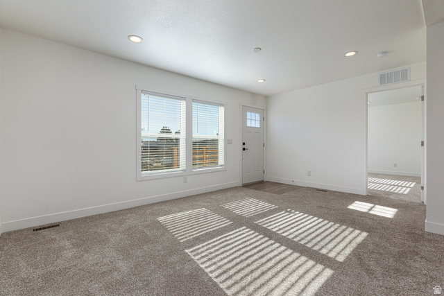 749 Riddle Drive Fredonia, AZ 86022 - Photo 20 of 41 Empty room with carpet floors and recessed lighting