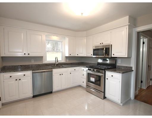 68 Upland Street Worcester, MA 01607 - Photo 5 of 17 a kitchen with granite countertop white cabinets white stainless steel appliances with a sink and dishwasher