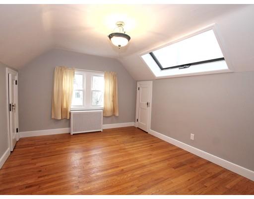 68 Upland Street Worcester, MA 01607 - Photo 10 of 17 a view of an empty room with wooden floor and a window