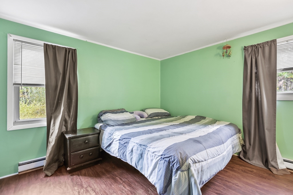 285 Abel Road Rindge, NH 03461 - Photo 12 of 39 a bedroom with a bed and a window