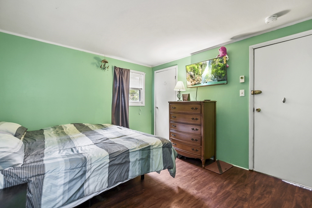 285 Abel Road Rindge, NH 03461 - Photo 13 of 39 a bedroom with a bed and a dresser