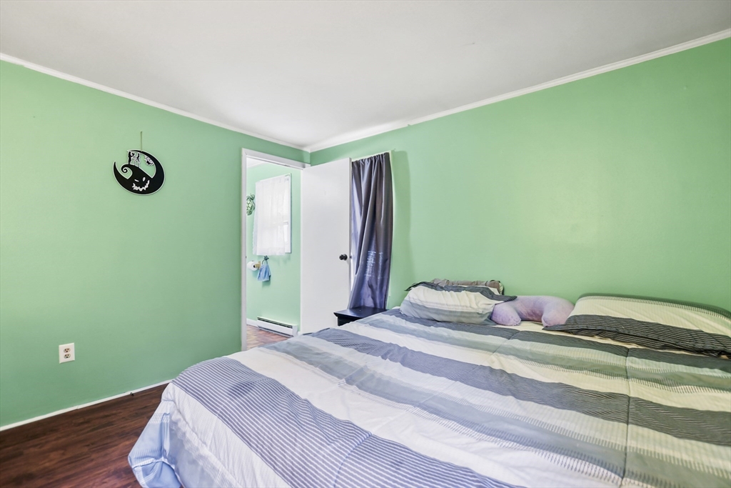 285 Abel Road Rindge, NH 03461 - Photo 14 of 39 a bedroom with a bed and a window