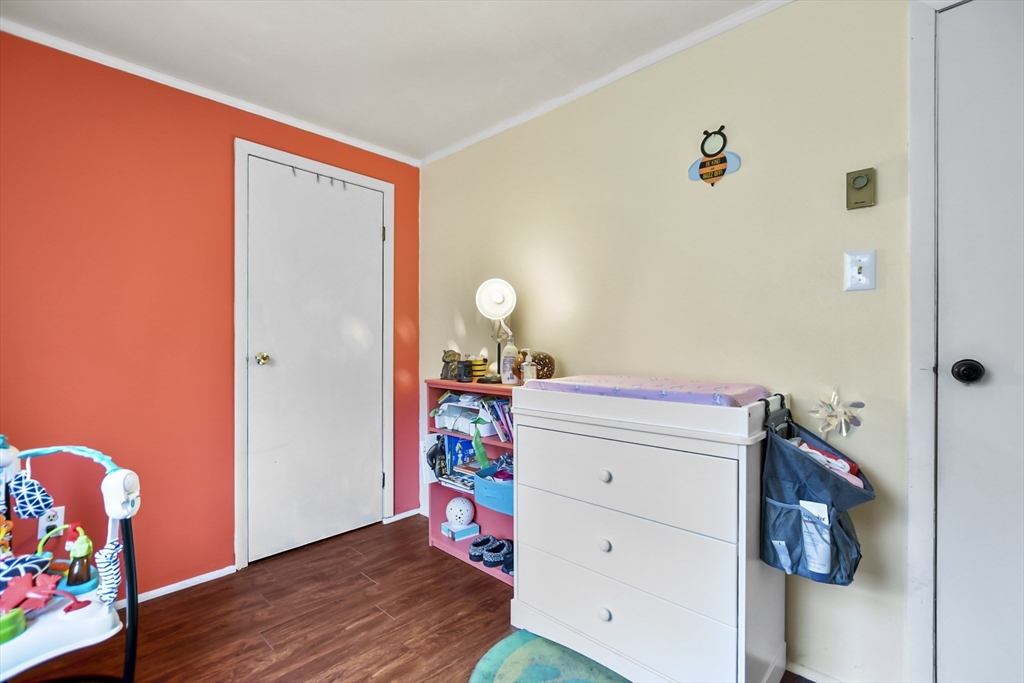 285 Abel Road Rindge, NH 03461 - Photo 20 of 39 a view of a bedroom with baby bed and toys
