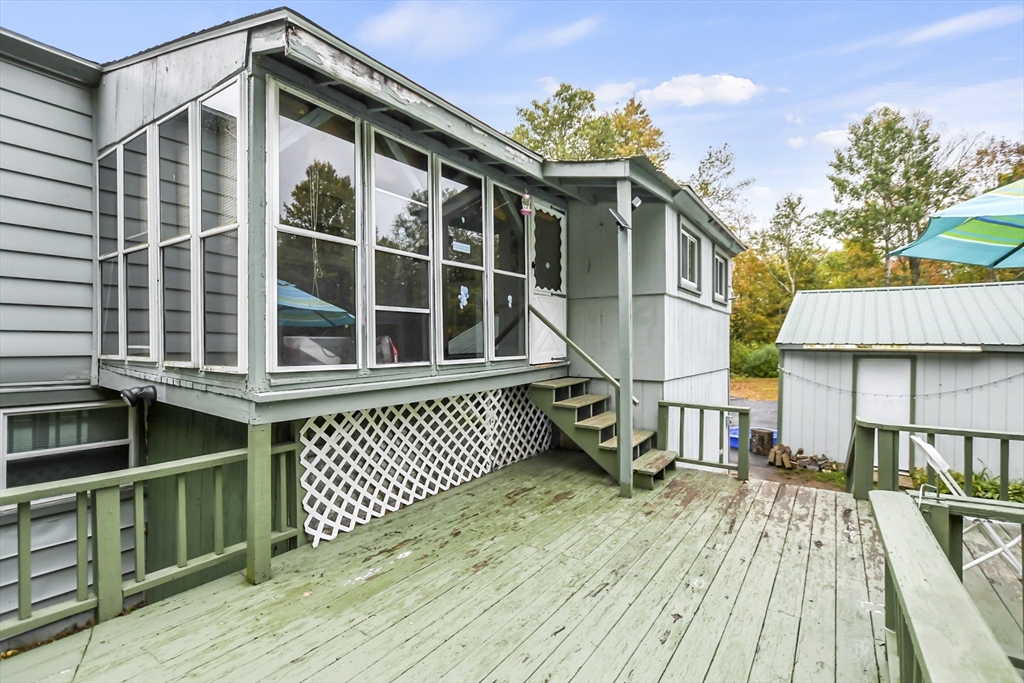 285 Abel Road Rindge, NH 03461 - Photo 29 of 39 a front view of a house with a wooden deck