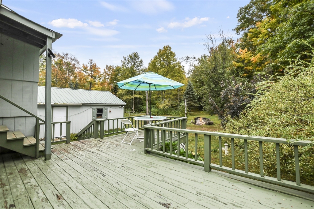 285 Abel Road Rindge, NH 03461 - Photo 30 of 39 a view of balcony with wooden floor and outdoor seating