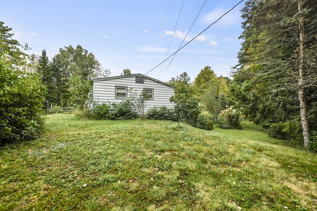 285 Abel Road Rindge, NH 03461 - Photo 33 of 39 a view of a house with a yard