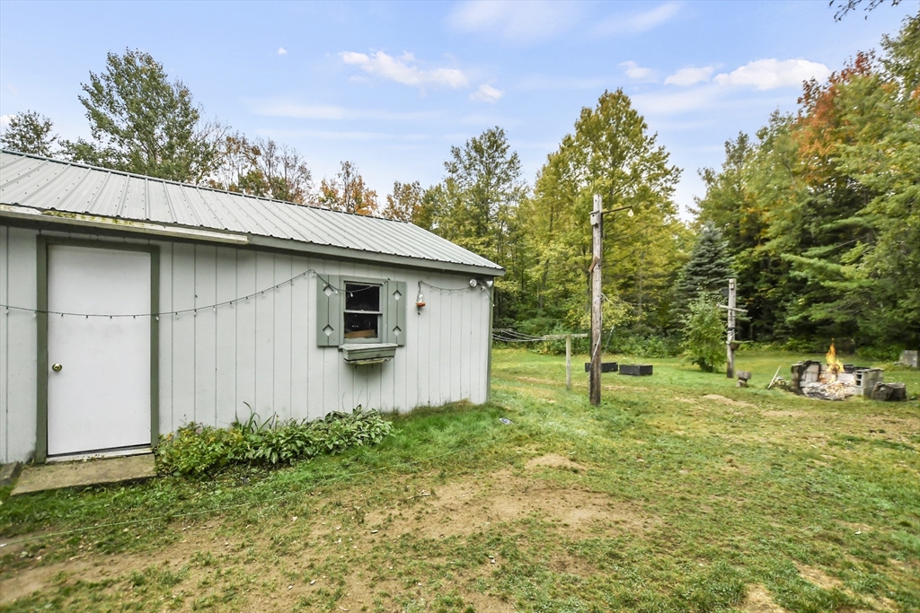 285 Abel Road Rindge, NH 03461 - Photo 34 of 39 a house with trees in the background