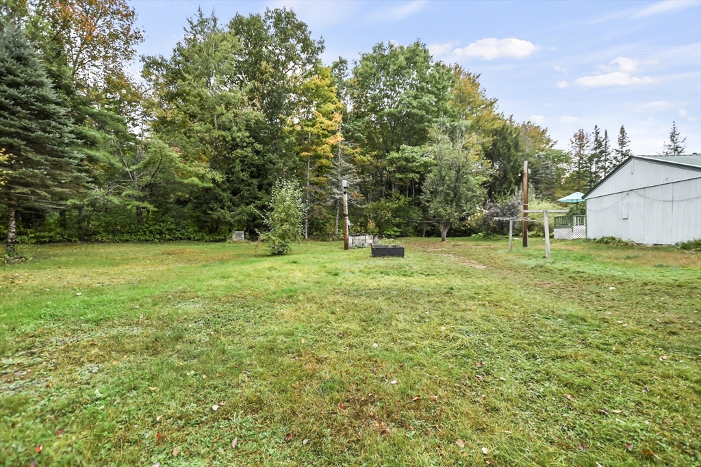 285 Abel Road Rindge, NH 03461 - Photo 36 of 39 a view of a house with a yard