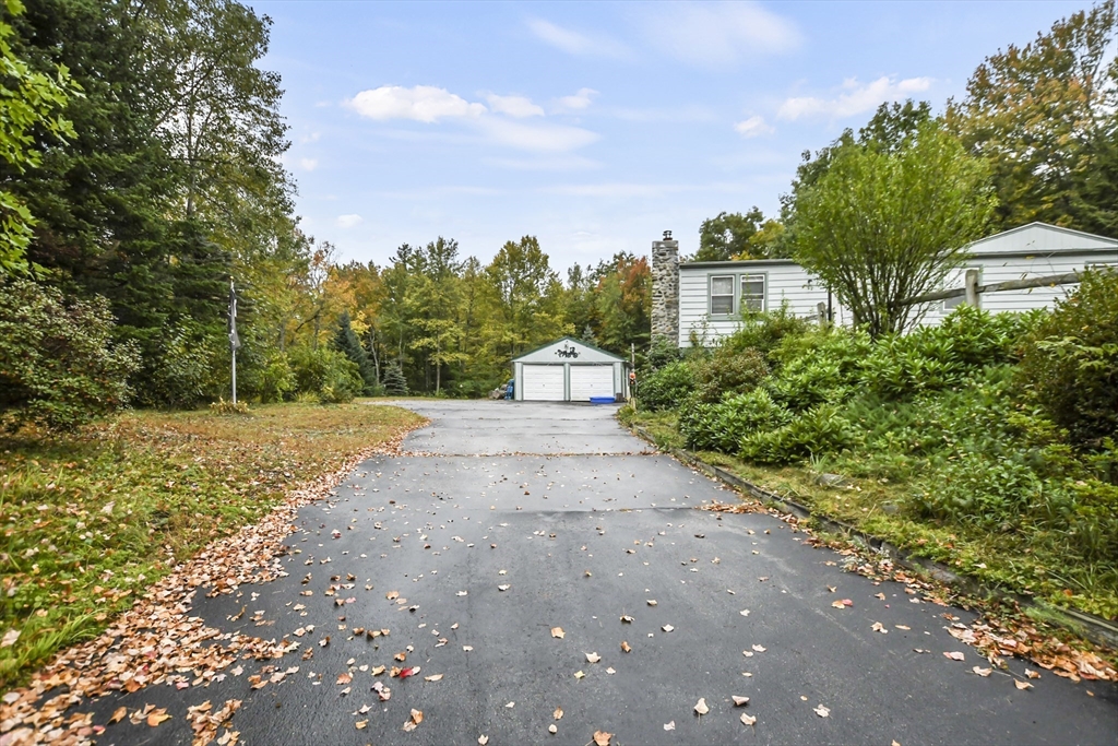 285 Abel Road Rindge, NH 03461 - Photo 38 of 39 a front view of a house with a yard and trees