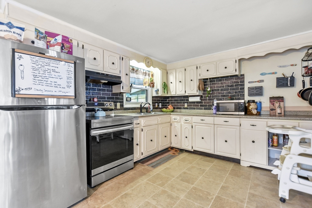 285 Abel Road Rindge, NH 03461 - Photo 6 of 39 a kitchen with stainless steel appliances granite countertop a refrigerator sink and cabinets