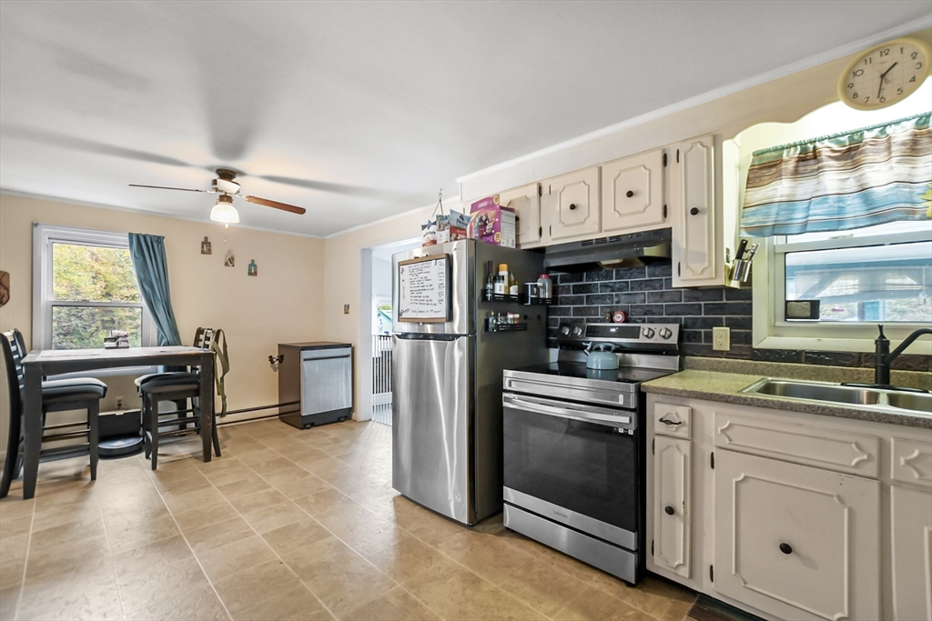285 Abel Road Rindge, NH 03461 - Photo 7 of 39 a kitchen with cabinets and chairs