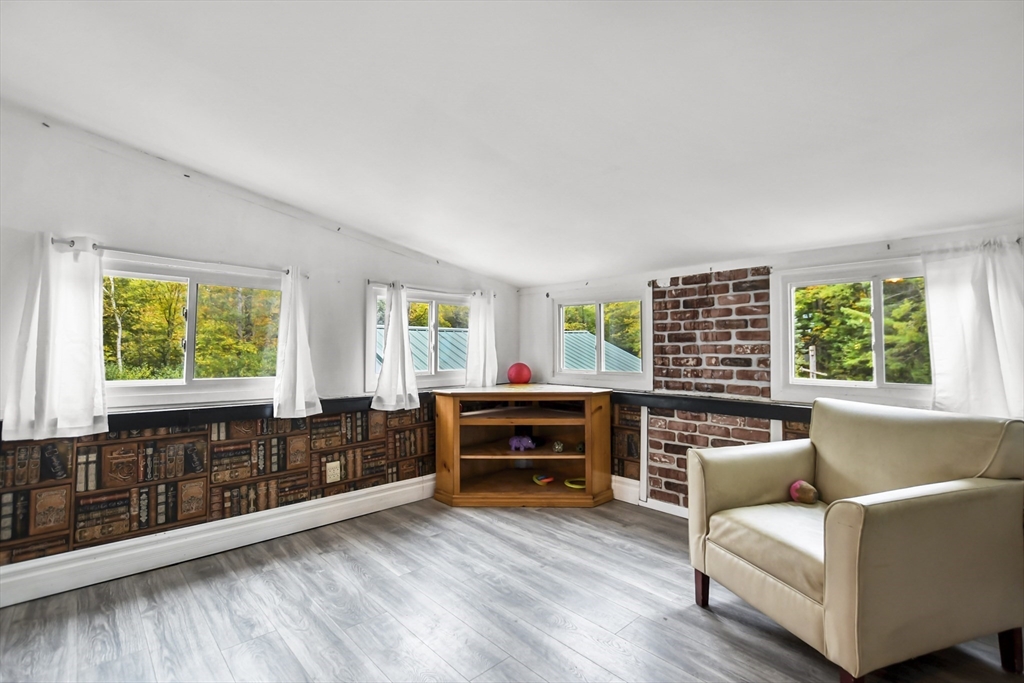 285 Abel Road Rindge, NH 03461 - Photo 10 of 39 a living room with furniture and a window