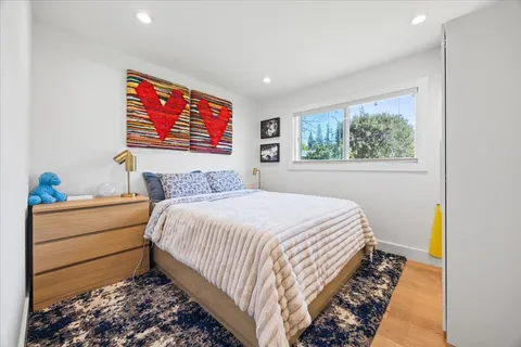 a bedroom with bed and a window