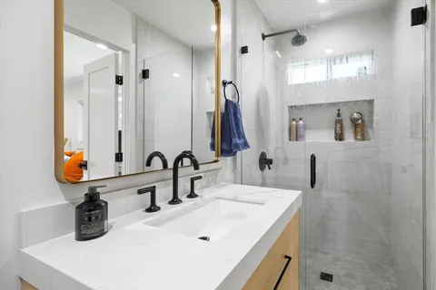 a bathroom with a sink and a mirror