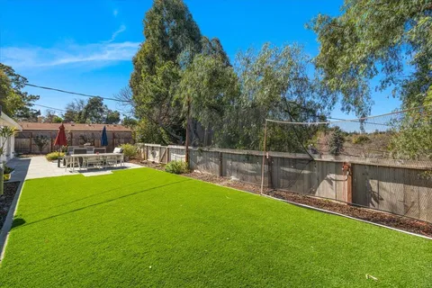 a view of a garden with sitting area