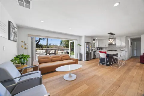 a living room with furniture and a table