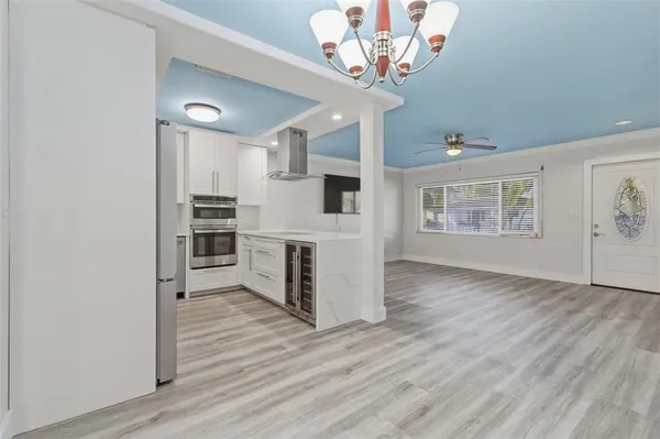 a view of a livingroom with a kitchen