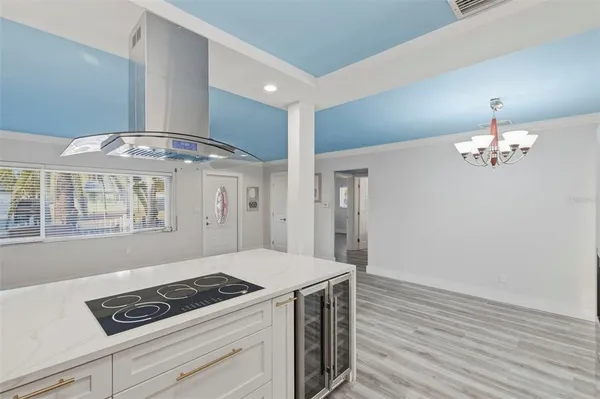 a kitchen with a stove and cabinets