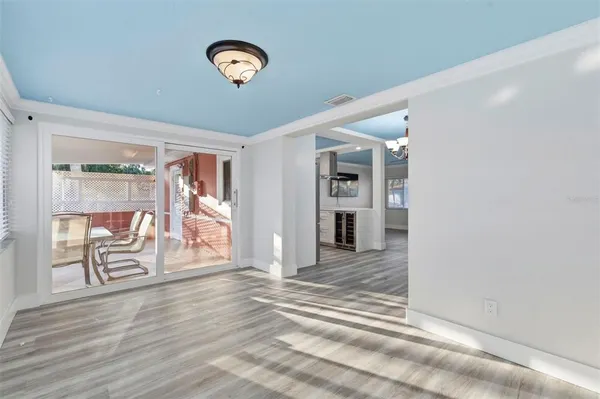 a view of a room with wooden floor