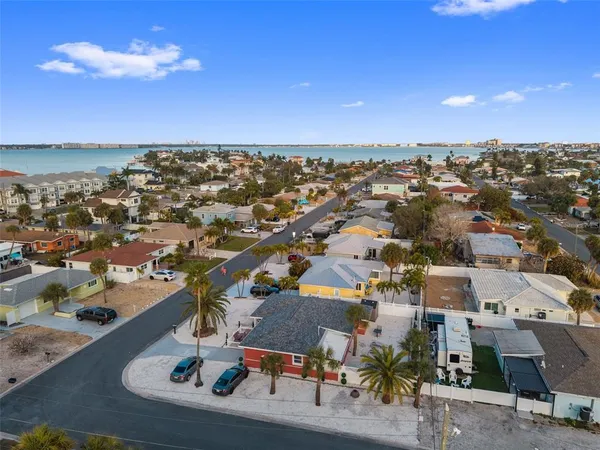 an aerial view of a house with a ocean view