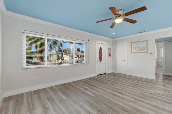 a view of an empty room with a window