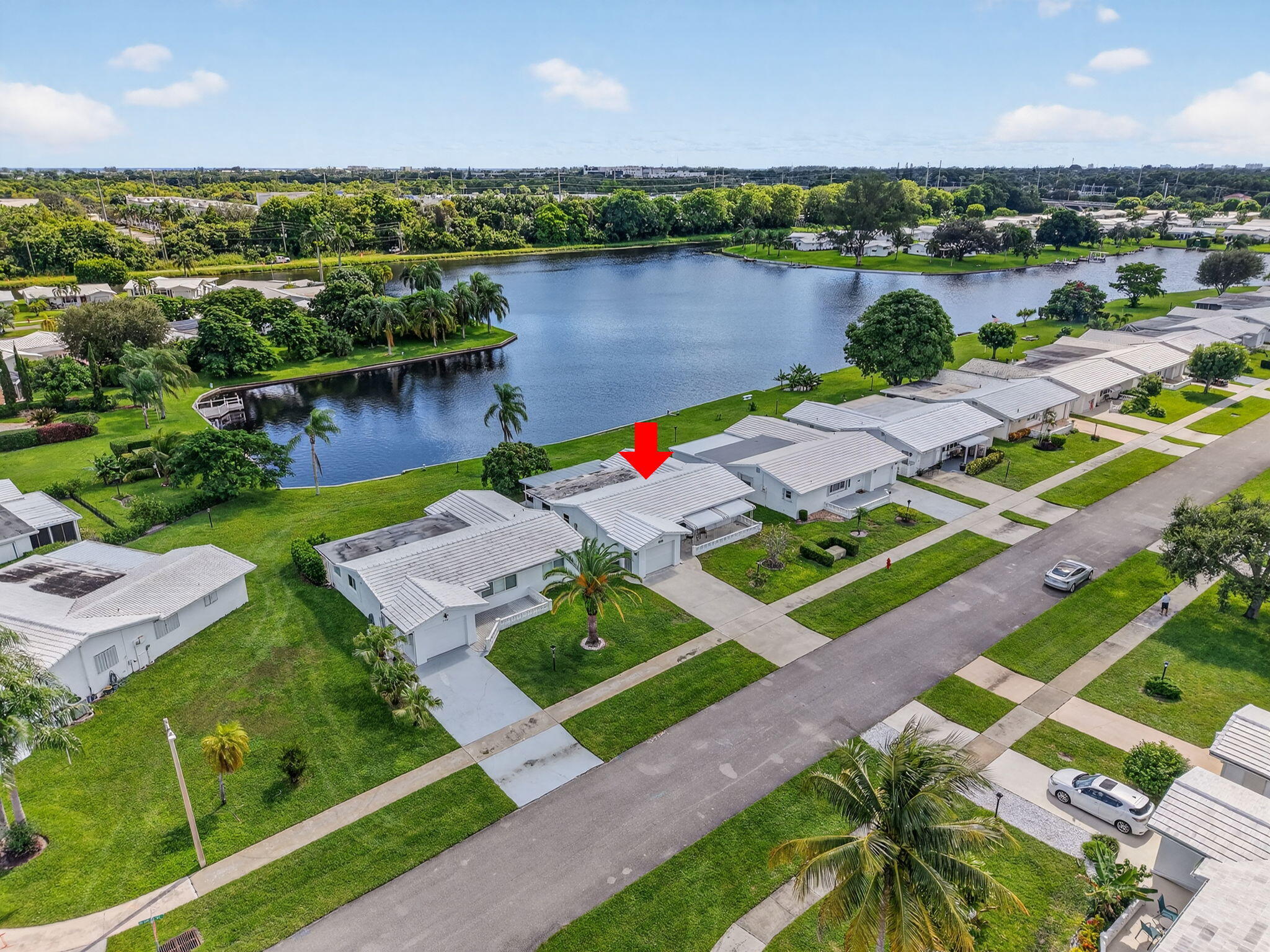 1704 Southwest 16th Street Boynton Beach, FL 33426 - Photo 2 of 44 an aerial view of a house with outdoor space and lake view