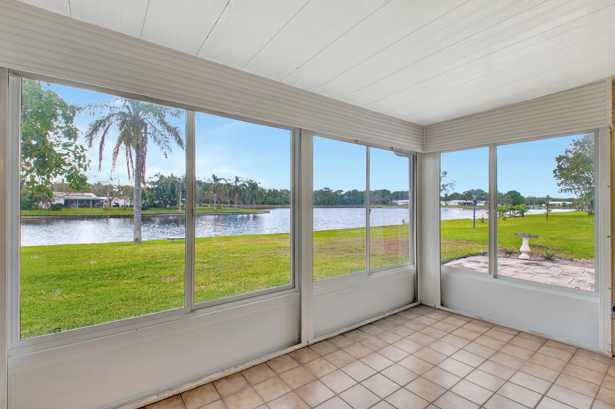 1704 Southwest 16th Street Boynton Beach, FL 33426 - Photo 4 of 44 a view of an ocean and a floor to ceiling window with an outdoor space