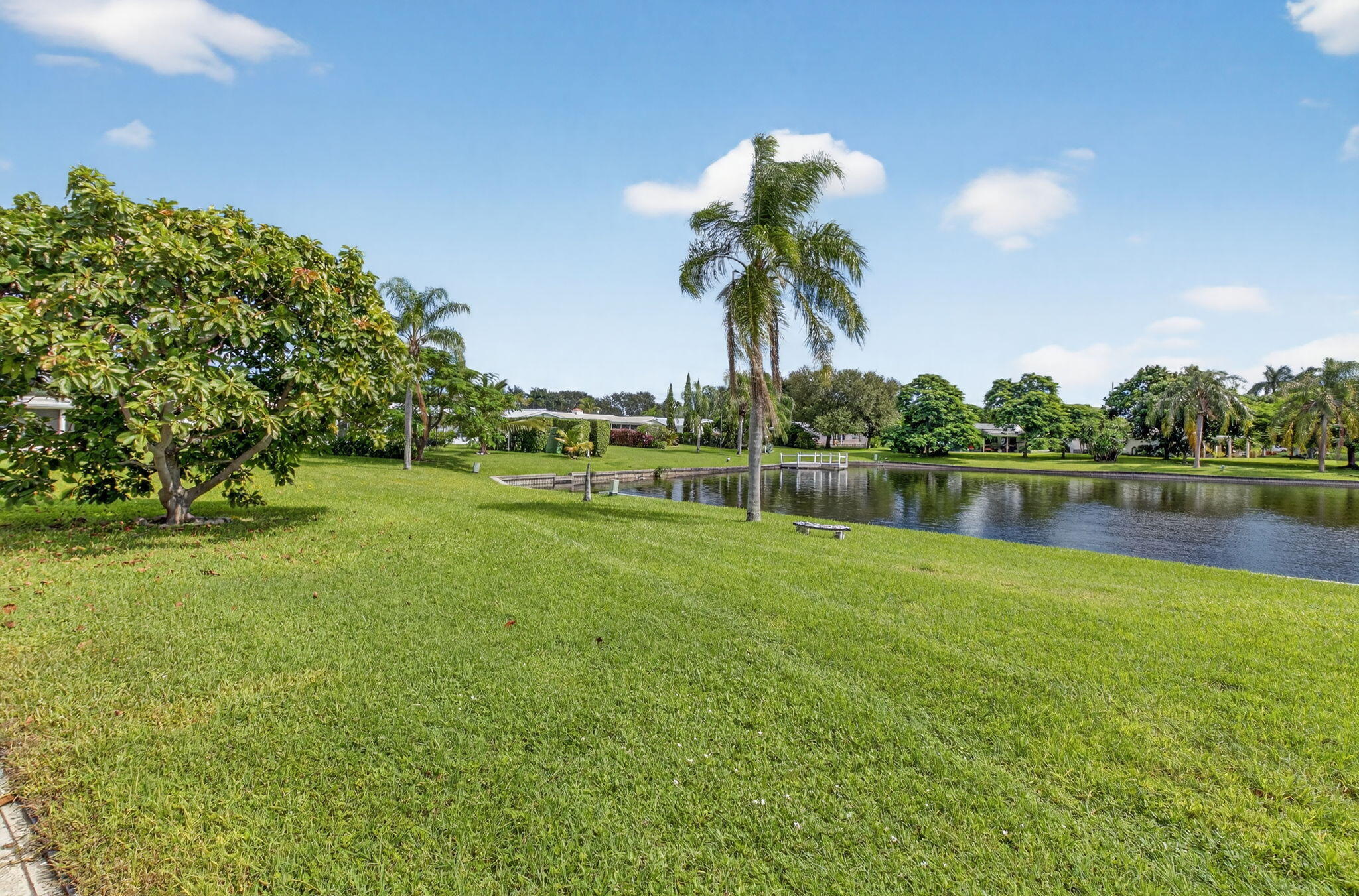 1704 Southwest 16th Street Boynton Beach, FL 33426 - Photo 7 of 44 a view of a lake with a big yard