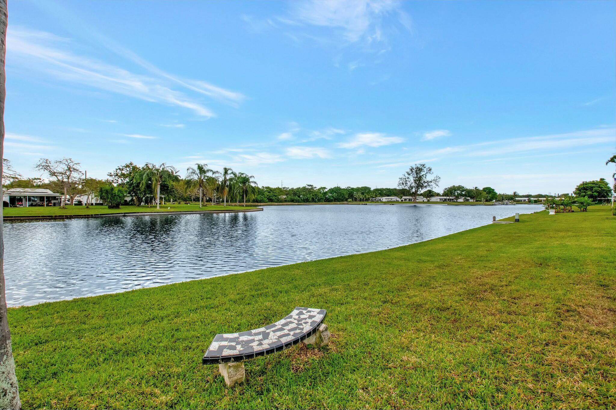 1704 Southwest 16th Street Boynton Beach, FL 33426 - Photo 8 of 44 a view of a lake with houses in the background