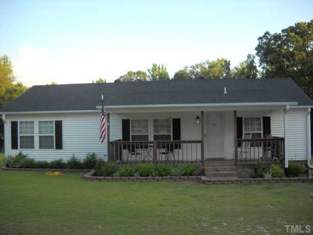 2445 Zacks Mill Road Angier, NC 27501 - Photo 1 of 15 Large front porch and upgraded windows. This is a cozy spot on a 2.02 ac wooded lot.