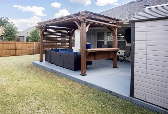 a view of sitting area in front of house