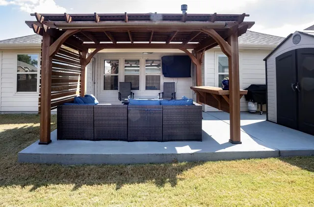 a view of a couches and a fireplace in the patio