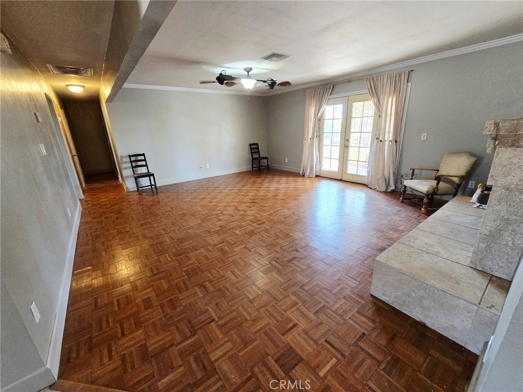 a view of a livingroom with furniture and stairs