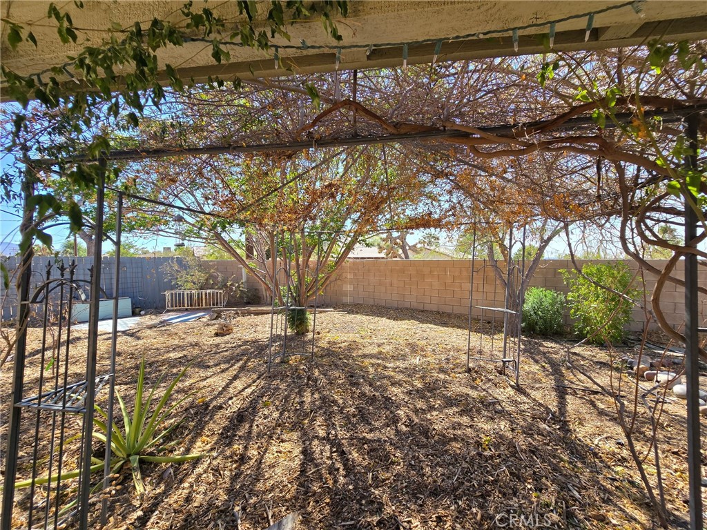 20221-20221 Modoc Road Apple Valley, CA 92308 - Photo 17 of 23 a view of a yard covered with snow in front of house