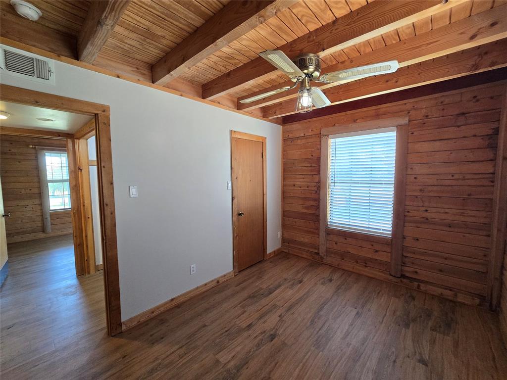 3505 Farmer Road Azle, TX 76020 - Photo 13 of 40 Rear bedroom downstairs located near utility closet, and has its own walk-in closet!