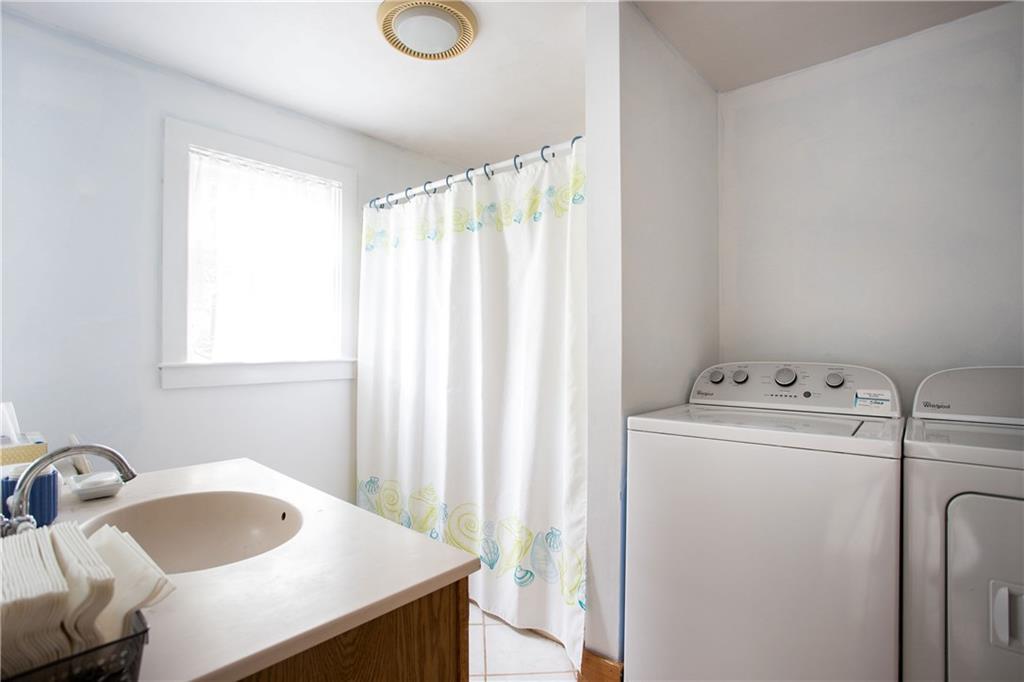 9 Garrison Point York, ME 03909 - Photo 17 of 33 The bathroom also houses the laundry.