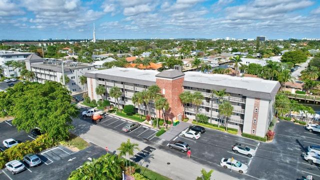 an aerial view of a house with a lake view