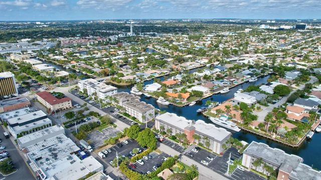 a kitchen with granite countertop a sink stove and refrigerator