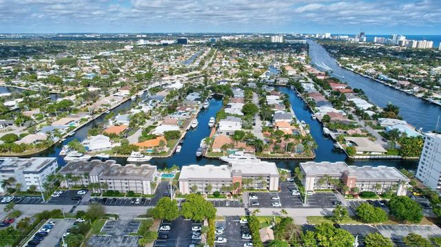 a kitchen with white cabinets and refrigerator