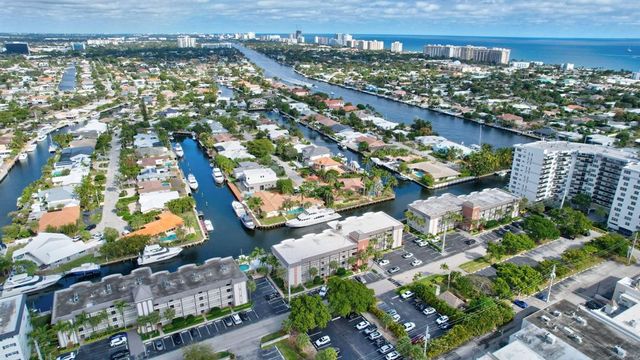 a bedroom with a bed bookshelf and a window