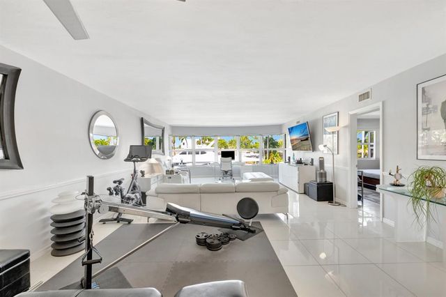 a bathroom with a double vanity sink mirror and shower