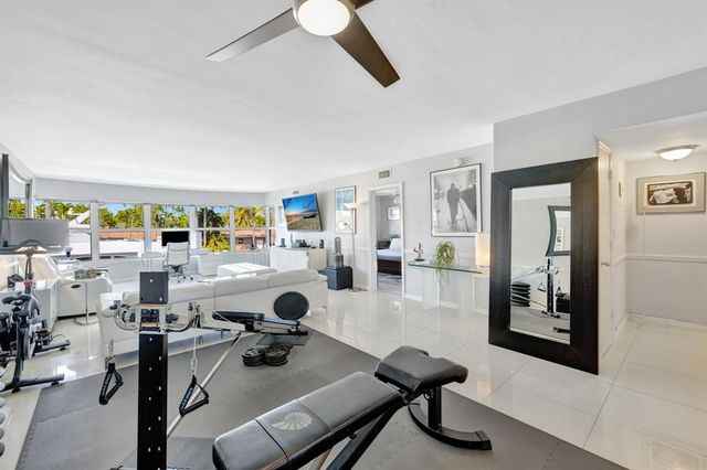 a bathroom with a shower and a mirror