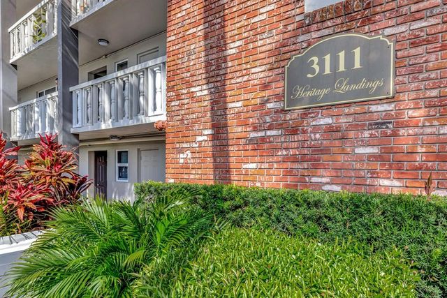 a view of swimming pool with outdoor seating and plants