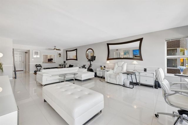 a bedroom with furniture and a flat screen tv