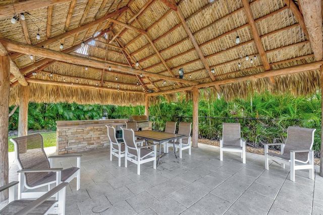 a view of an outdoor sitting area with brick walls