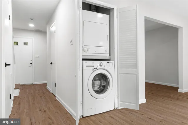 a view of a hallway with washer and dryer