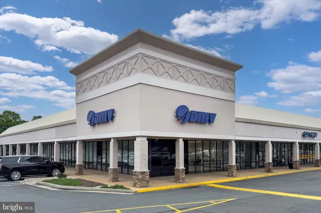 a view of a building with retail shops